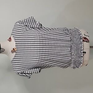 ADRIANNA PAPELL checked black and cream top with butterfly sleeves. Size is Med.